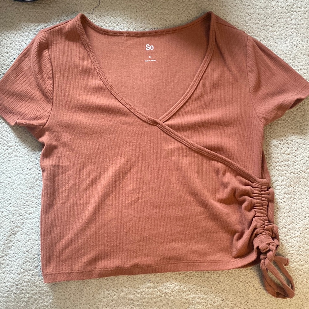 Cropped medium brownish colored top.